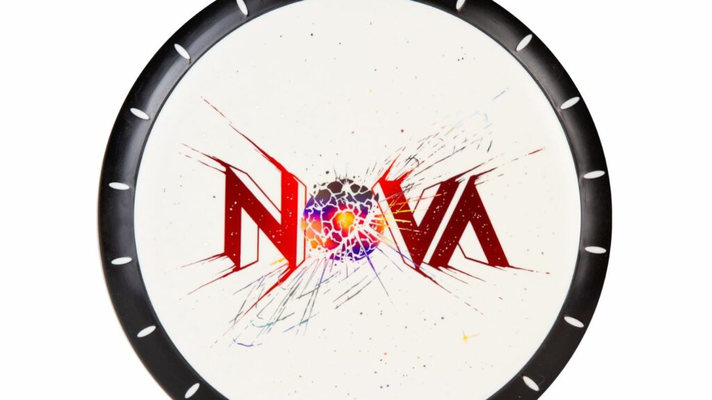 an Innova XXL Legendary XT Nova, with a black rim with a white pattern. The disc itself is white in color, with a red stamp. Notably, the inscription "Nova" is imprinted on the disc, where the letter "O" resembles an exploding supernova.