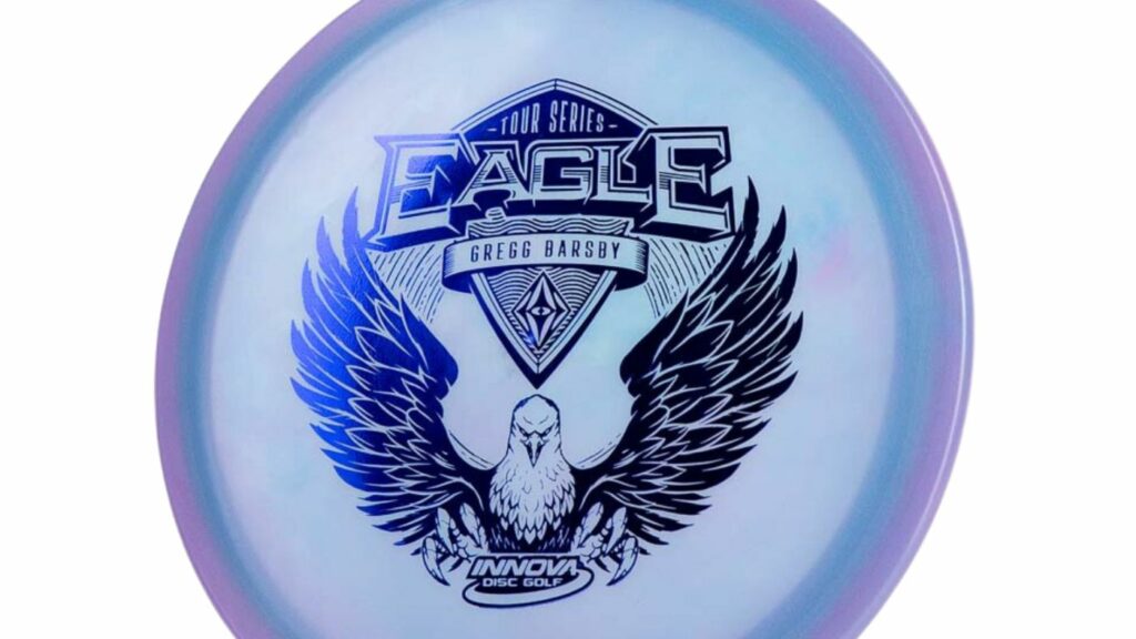 An Innova Swirly Star Eagle (Gregg Barsby Tour Series) Purple/Blue disc with black stamp